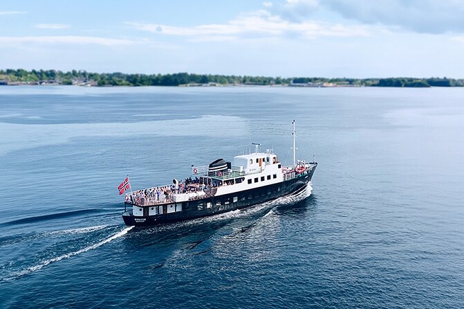 All About the Fjords in One Tour by Bus and Boat from Ålesund - Hjørundfjord by boat, with villages along the shore