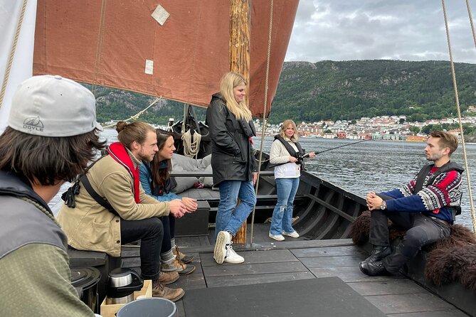 Bergen Fjord Experience Aboard Viking-style Ship - Helping with the sail, steering, and fishing