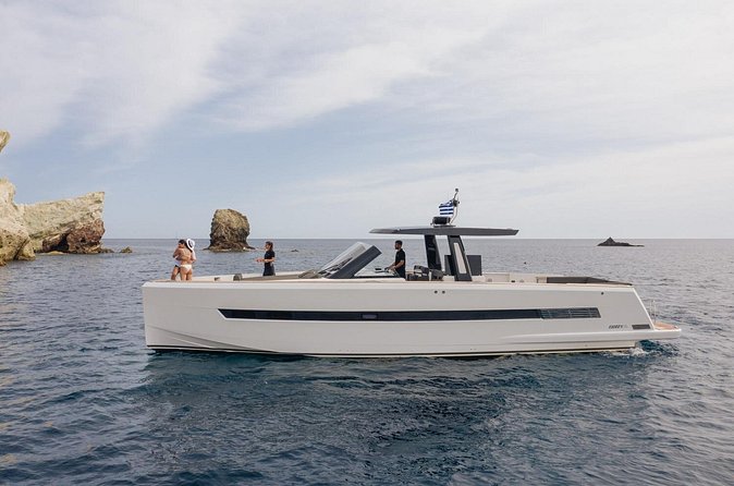 Caldera Private Cruise with Fjord 52 - The Akrotiri lighthouse and the volcanic coast