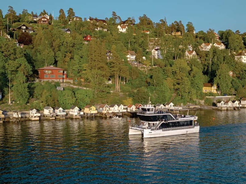 Oslo: Guided Sightseeing Fjord Cruise on Premium Silent Boat - Indoor comfort, outdoor views, and the onboard cafe